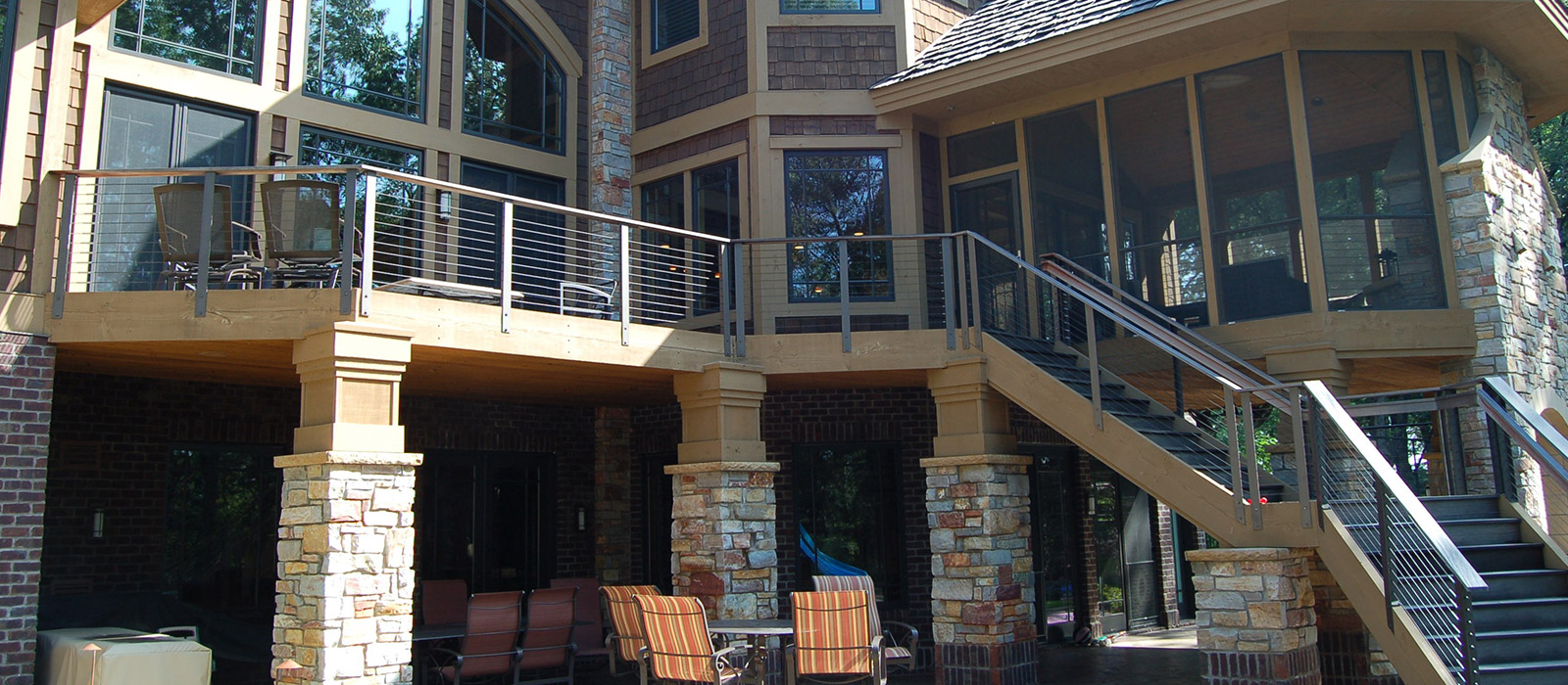 Screened-in Porch Leading to Large Decked. The Deck Covers a Dining & Seating area